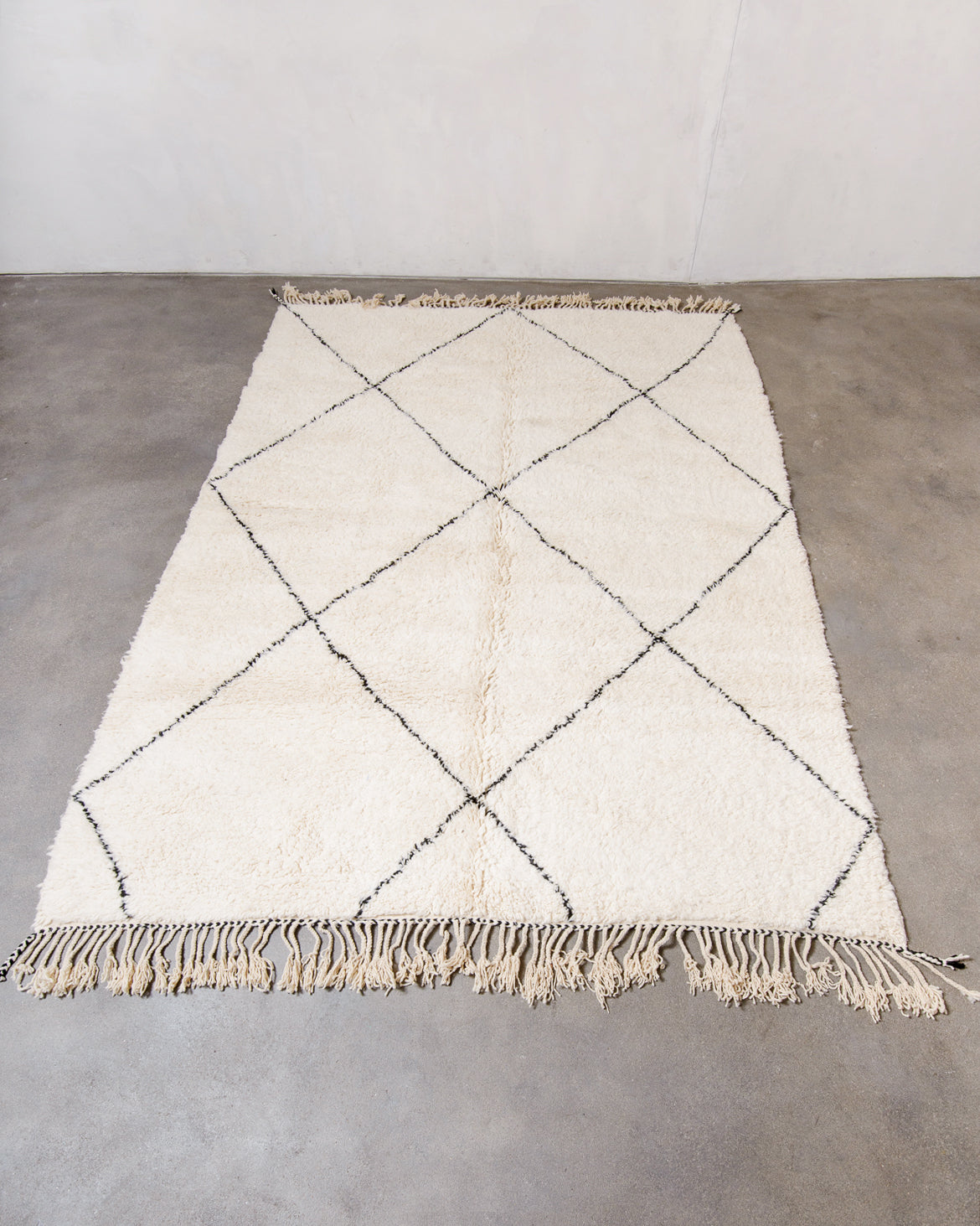 Modern, designer, handcrafted Berber rug from Morocco. Beniourain carpet with minimalist design, natural wool pile and a fluffy texture.